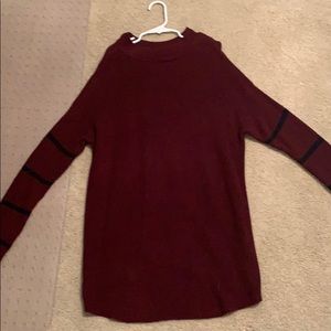 Maroon sweater with black stripes on the sleeves